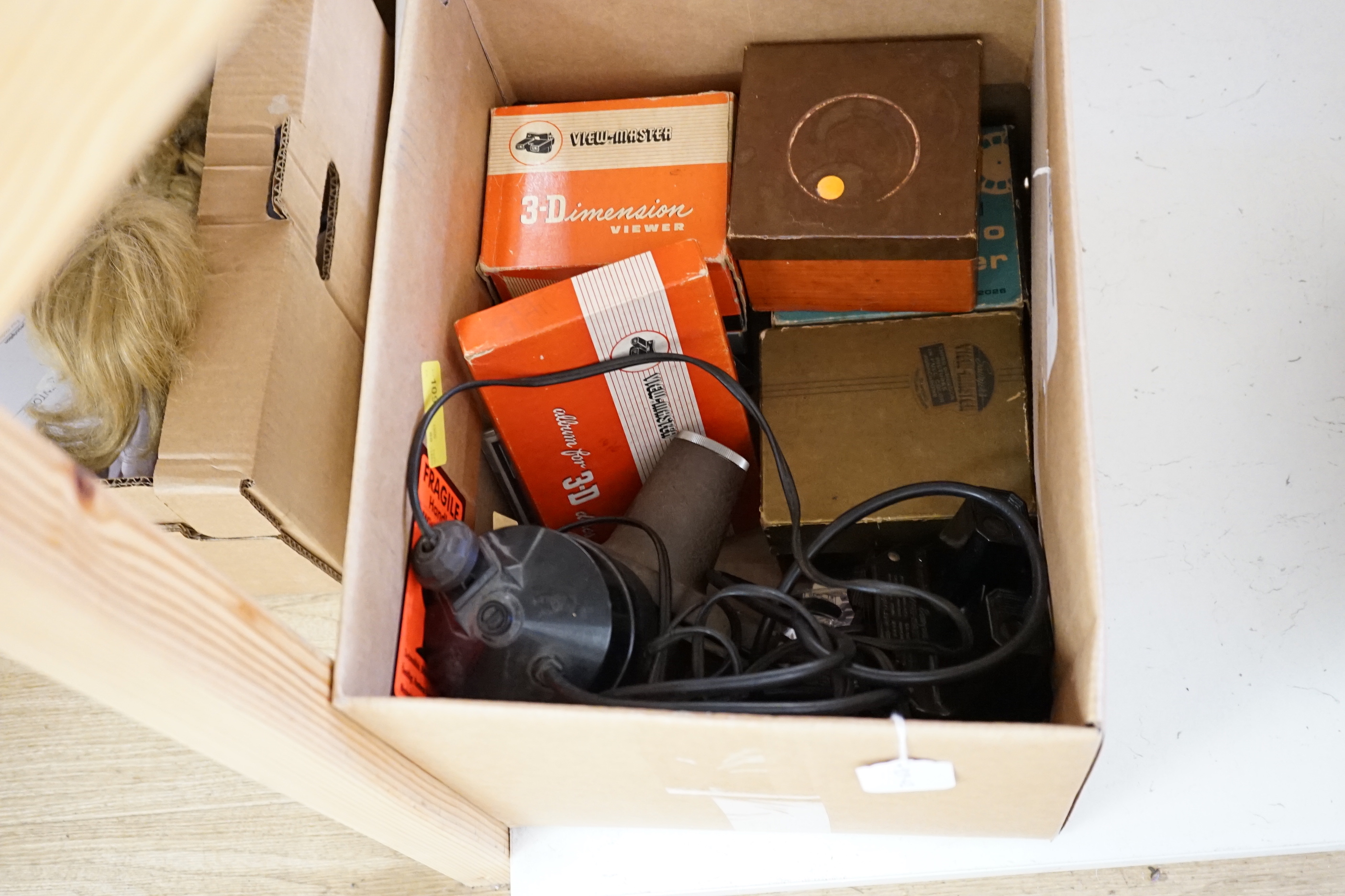 Eight view-masters, including a Model A and Model C, a projector and a small quantity of cards
